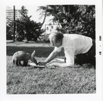 [1967-12] Aardvark interacting with artist Albert Staehle at Crandon Park Zoo