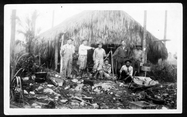 Photographs of Tamiami Trail, Everglades City, Chatham Bend, agriculture and Jaudon's businesses, 1903-1930. - 1. West construction and engineering camp Roberts, furthest point west of Tamiami Trail from Miami. Assistants and Indian Guides. January 8, 1924. no. X-625-1.