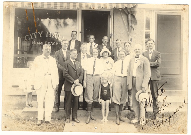 Early Miami Beach City Halls and city officials, 1920s - Photograph, recto: [A group of Miami Beach officials and employees in front of first City Hall facade, 1921]