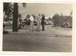Men standing in front of parking lot