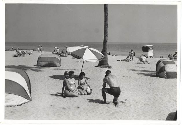 Photographer taking picture of women on the beach