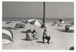 Photographer taking picture of women on the beach