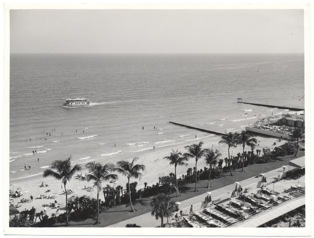 Beach goers and boats seen from building on Miami Beach