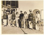 Miami Beach Dog Track: men and women posing with greyhound dogs