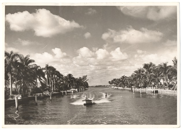 Water-skiers in a waterway