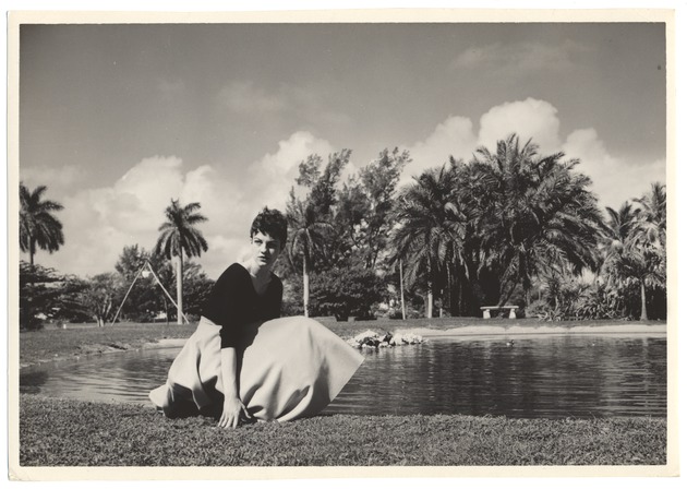 Sandi Justis poses in front of pond