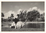 Sandi Justis poses in front of pond