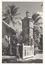 Dody Judah at the entrance of a mansion