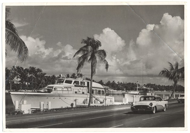 Yacht in the waterway near road
