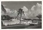 Yacht in the waterway near road