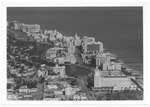 Looking north from Twenty-third Street showing oceanfront hotels including the Palm Court, Roney Plaza, Seville, Fontainbleau, Eden Roc, and Doral