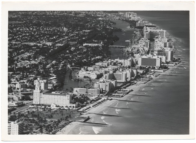 Looking north over the ocean from Collins to North Beach, showing the Roney Plaza, Wofford, Algiers, Seville, and Fontainebleau Hotels - 