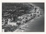 Looking north over the ocean from Collins to North Beach, showing the Roney Plaza, Wofford, Algiers, Seville, and Fontainebleau Hotels
