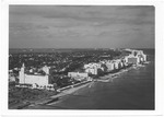 [1965] Looking north from the ocean, showing the oceanfront hotels from the Roney Plaza to the Fontainebleau