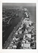 Aerial view looking north from Collins Avenue and Thirty-second Street, showing the Atlantic Towers, and the International, Fontainebleau, Eden Roc, and Executive House Hotels with Allison Island in the distance, April 1962