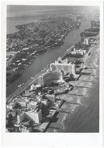 Looking north from the ocean at Forty-third Street, showing the Fontainbleau, Eden Roc, and Executive Hotels, the spite wall, and Allison Island in the distance