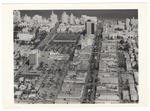 Miami Beach looking east over Lincoln Road Mall from Michigan Avenue. The Colony Theater, the Miami Beach Federal Bank and the DiLido Hotel on the left. The Sands and New Yorker hotels on the upper right