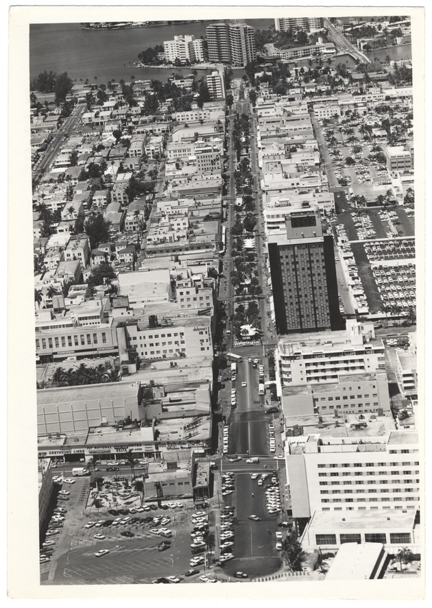 Looking west from the ocean showing Lincoln Road Mall, the DiLido Hotel, the Miami Beach Federal Bank, the Carib Theater and the Venetian Causeway in the back - 