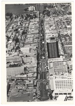 Looking west from the ocean showing Lincoln Road Mall, the DiLido Hotel, the Miami Beach Federal Bank, the Carib Theater and the Venetian Causeway in the back