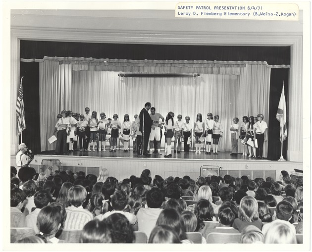 Miami Beach safety patrol presentations - Photograph, recto: [Mayor Dermer presenting during a safety patrol presentation at Leroy D. Feinberg Elementary School, June 4, 1971]