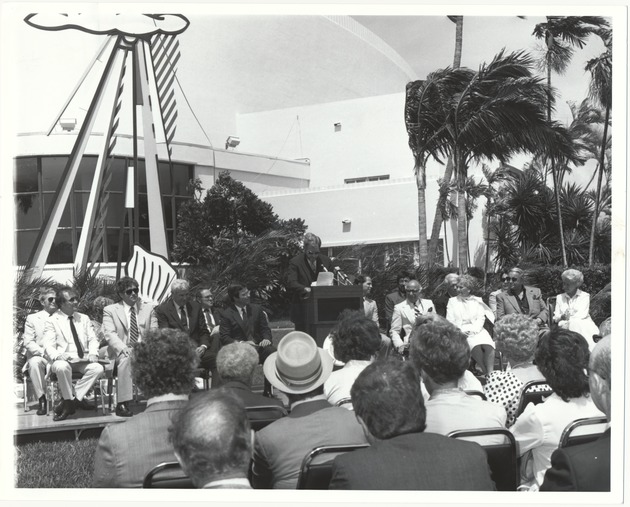 Miami Beach Convention Center and Jackie Gleason Theater events - Photograph, recto: [Rob Parks, City Manager speaking in front of Jackie Gleason Theater of the Performing Arts].