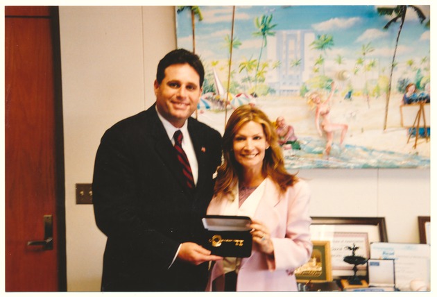 Miami Beach Mayor David Dermer presenting unidentified person with the key of the City of Miami Beach - 