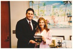 Miami Beach Mayor David Dermer presenting unidentified person with the key of the City of Miami Beach