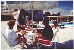 Diners by the Flamingo Hotel pool