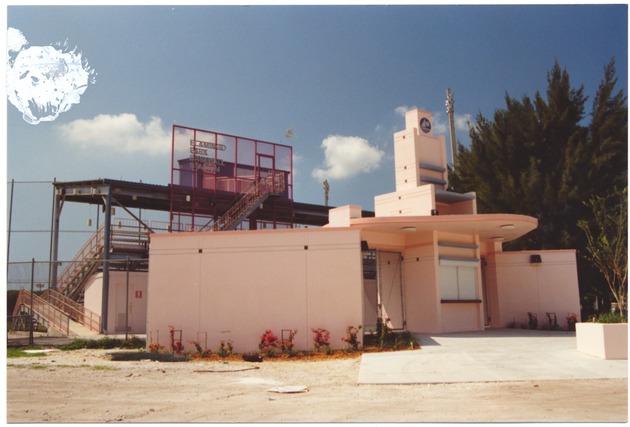 Flamingo Park and a parade on Ocean Drive - Photograph recto: [Flamingo Park baseball stadium and concession/ticket stand]