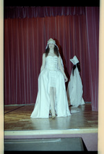 Women walking on stage