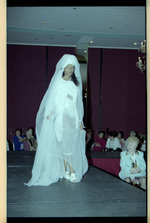 Woman in white dress on runway