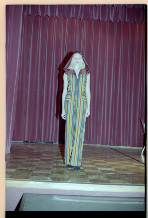 Woman poses on stage