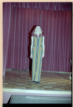 Woman poses on stage
