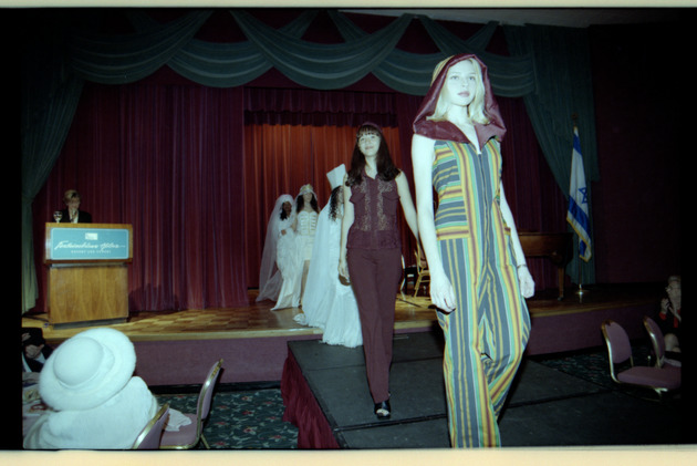 Models walking down runway