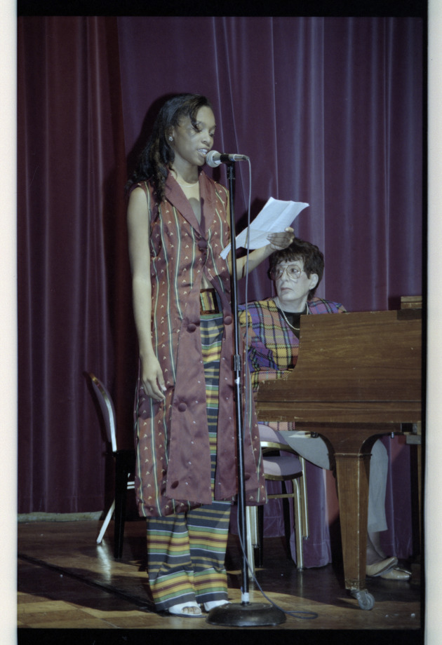 Woman speaking into microphone