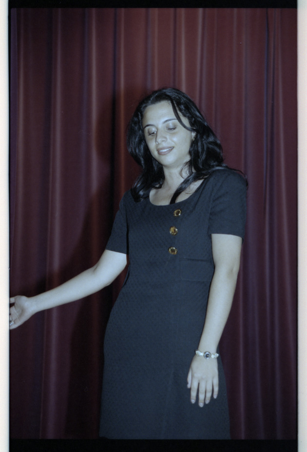 Woman speaking on stage - Recto Photograph