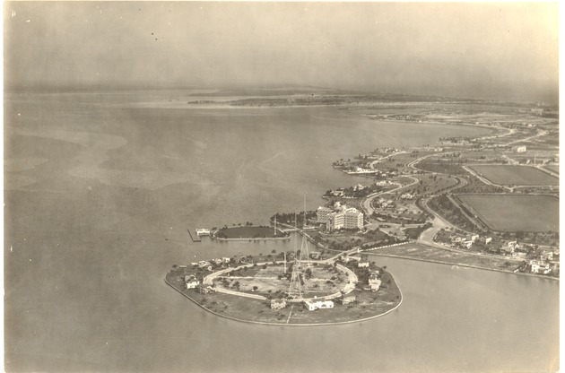Aerial views of the Nautilus Hotel area - Photograph, recto: [Aerial view of the bay side of Miami Beach showing the Nautilus Hotel and Wireless Station, now the site of Mt. Sinai Hospital. Nautiuls Polo fields at right and Normandy Isle in the distance]