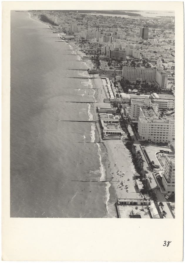 Aerial views of Miami Beach, 1960s - Photograph, recto: [Oceanfront looking south from Twenty-first Street with Roney Plaza at the middle right].