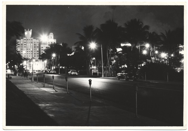 Miami Beach parking lots - Photograph recto: [Night view, Seventeenth Street looking west to National and Delano Hotels].