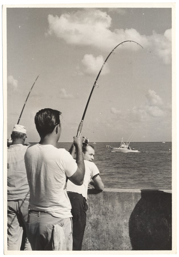Two Men Fishing Off the Pier  at Friendship Corner