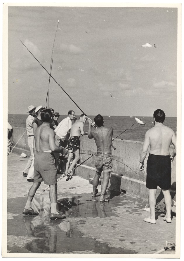 Men Fishing Off the Pier at Friendship Corner
