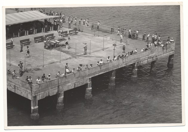 Men Fishing Off the Pier at Friendship Corner on Three Sides