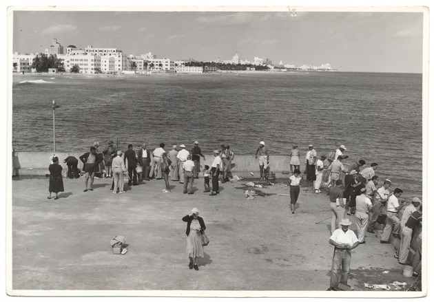 People at Friendship Corner with beaches and hotels in the background