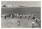 People at Friendship Corner with beaches and hotels in the background