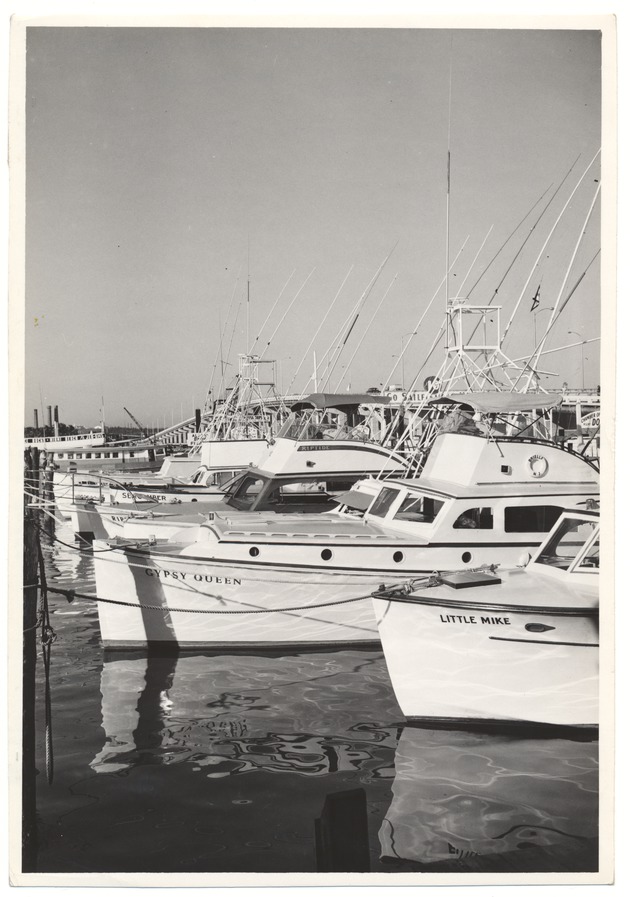 Boats, including "Gypsy Queen" and "Little Mike" at the Chamber of Commerce Docks at Fifth Street on the bay side