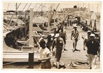 Men walking along the docks and boats, including "Playmate," "Gypsy Queen," and "Jimela"
