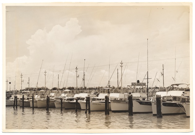 Docked boats, including "Prowler," "Bahama Mama," and "Seacomber"