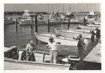Men in a boat, preparing to fish
