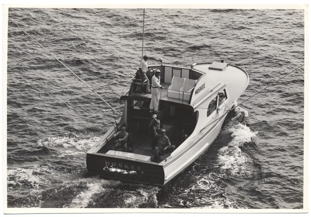 Men fishing from the boat "Huskee"