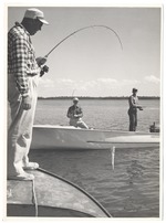 Man catching a fish in the water
